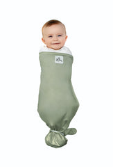 The Ollie Swaddle adjustable-closure closeup highlights customizable closures for growing babies