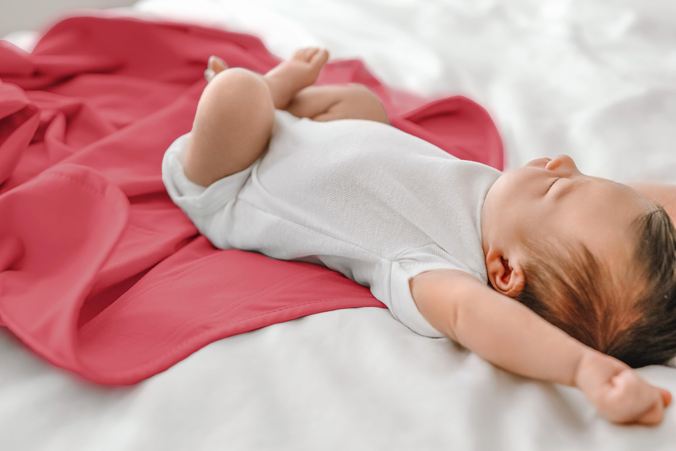 The Ollie Swaddle breathable-fabric showcases cooling, moisture-wicking material for all-night comfort.