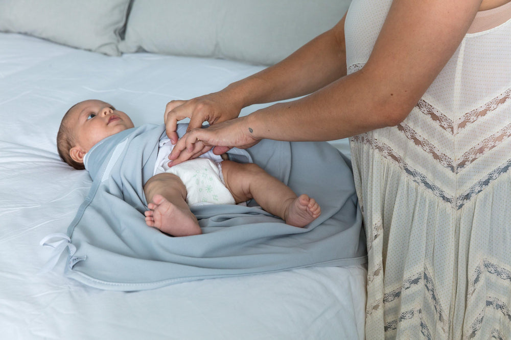The Ollie Swaddle lightweight design keeps baby comfortable year-round.