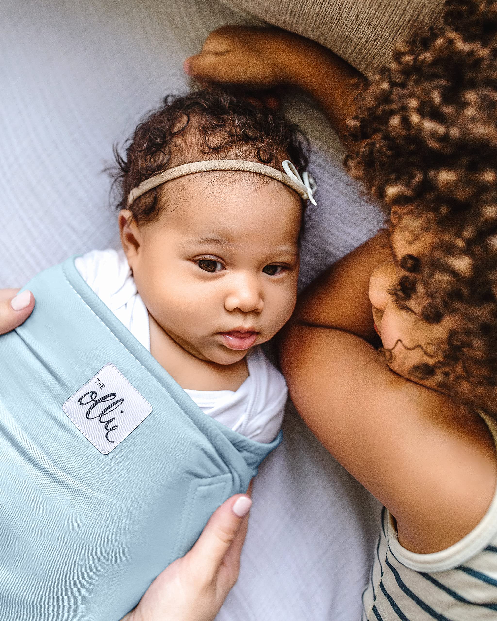 The Ollie Swaddle includes a mesh laundry bag for fabric protection.