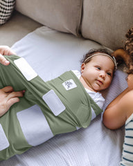 The Ollie Swaddle open-bottom design enables quick diaper changes