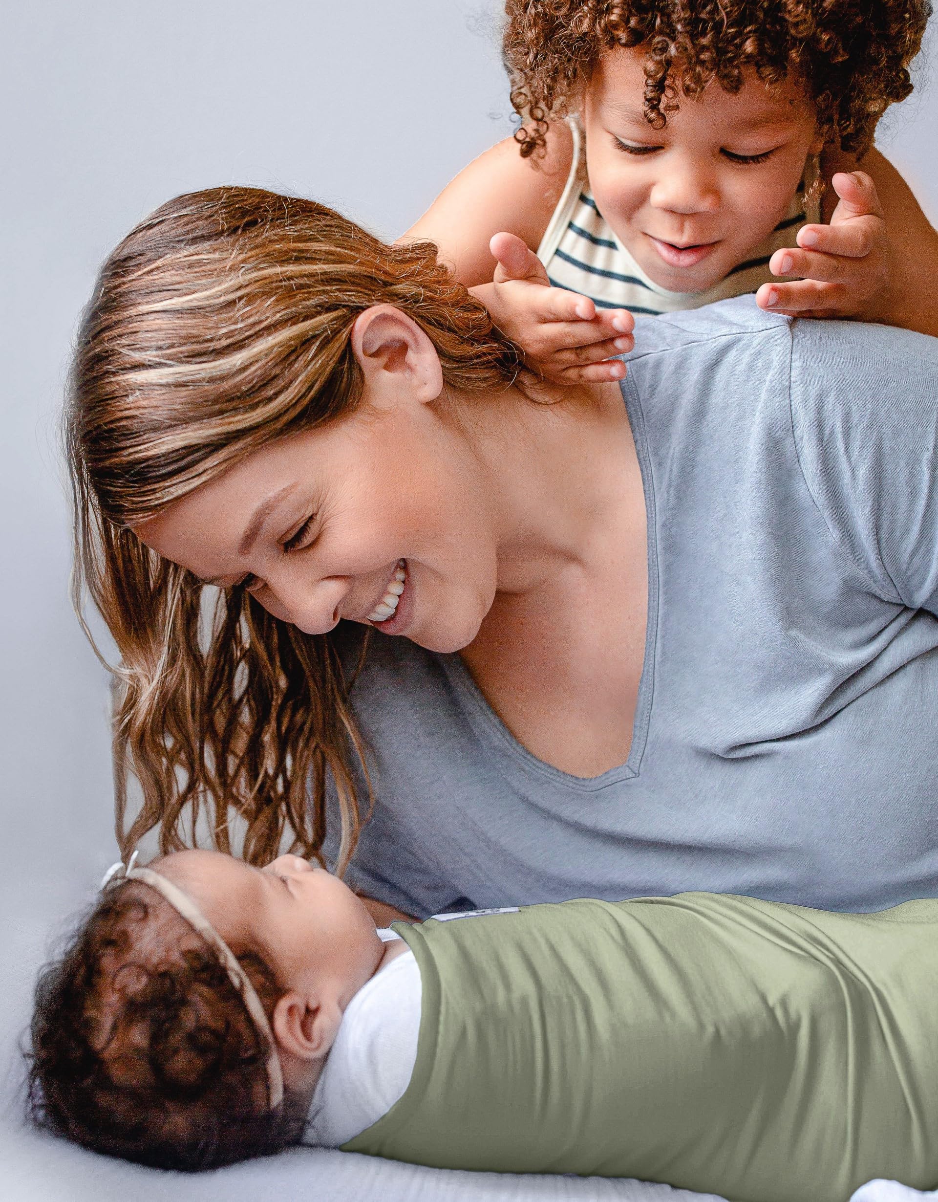 The Ollie Swaddle pediatrician-approved logo signals trusted newborn sleep support