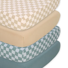 The Peanutshell 4-pack organic fitted crib sheets in checkered yellow teal for easy nursery styling