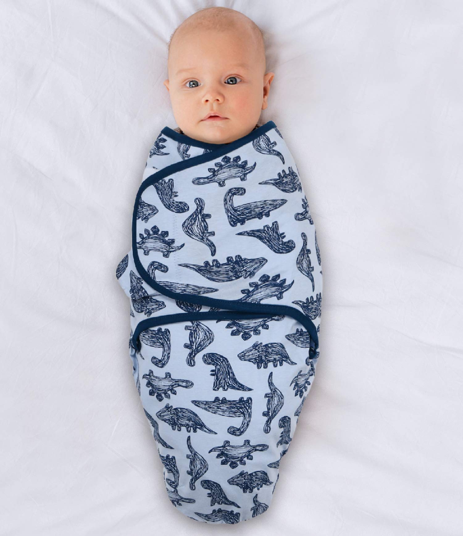 The Peanutshell blue dinosaur swaddle print offers a playful bedtime companion for naps.