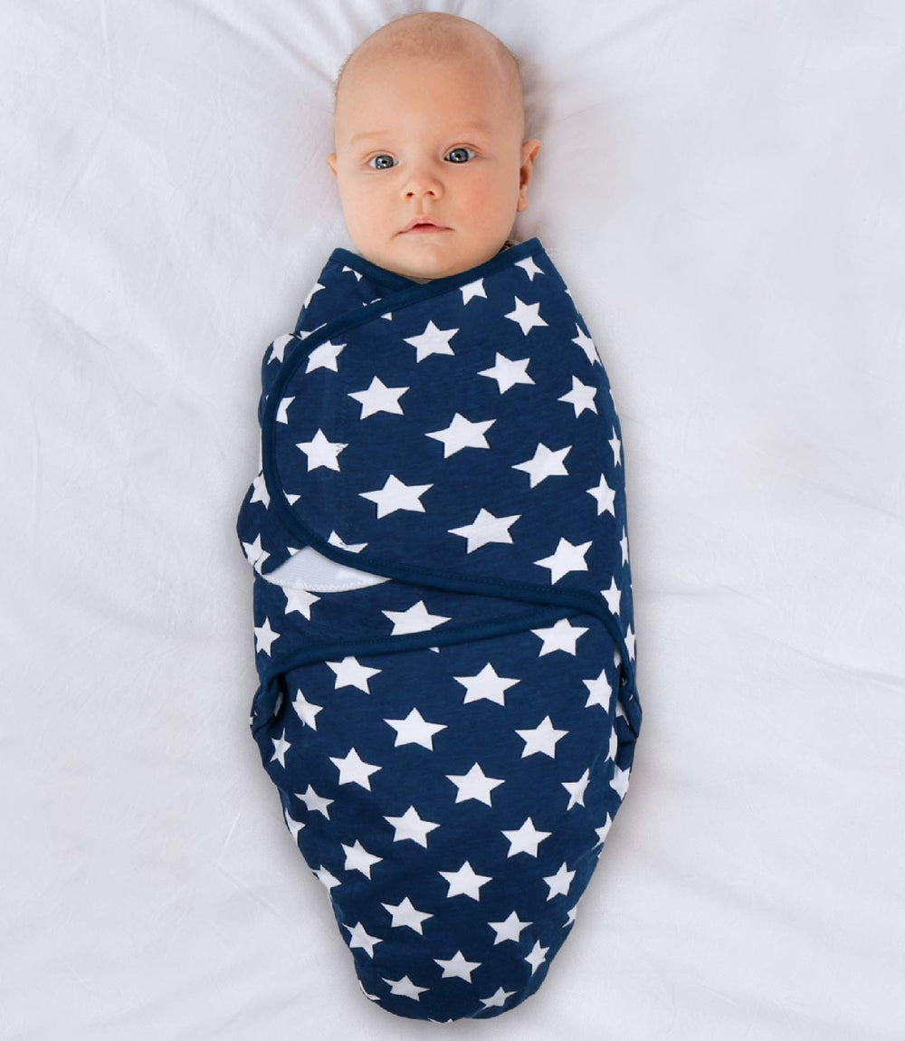 The Peanutshell blue dinosaur swaddle set in newborn-to-3m size demonstrates growing-baby sleep support.
