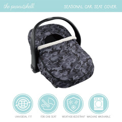 The Peanutshell car seat cover showcases black camo design for stylish baby travel