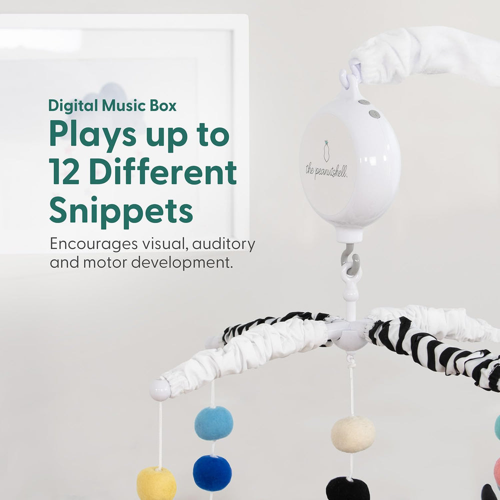 The Peanutshell high-contrast black-and-white design supports newborn visual engagement.