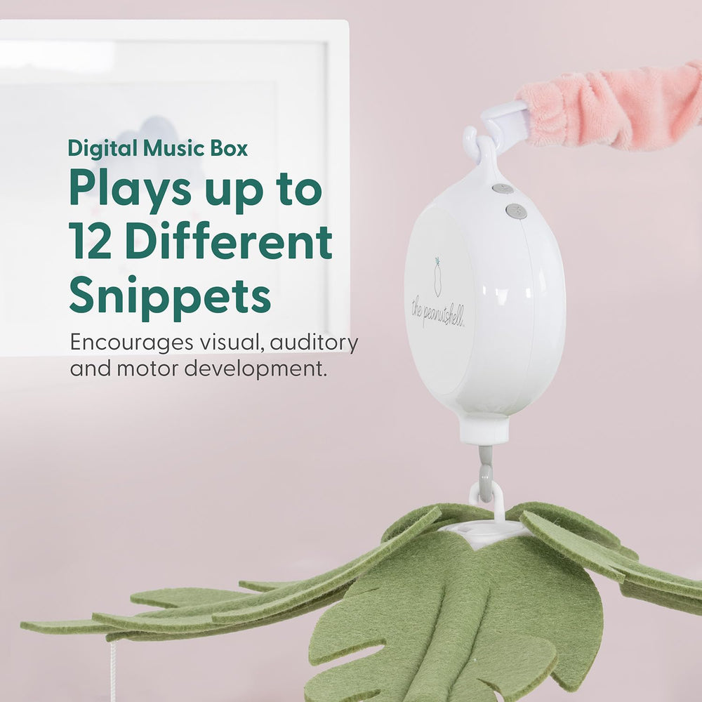 The Peanutshell crib mobile rotating motion shown in action for tranquil baby sleep.