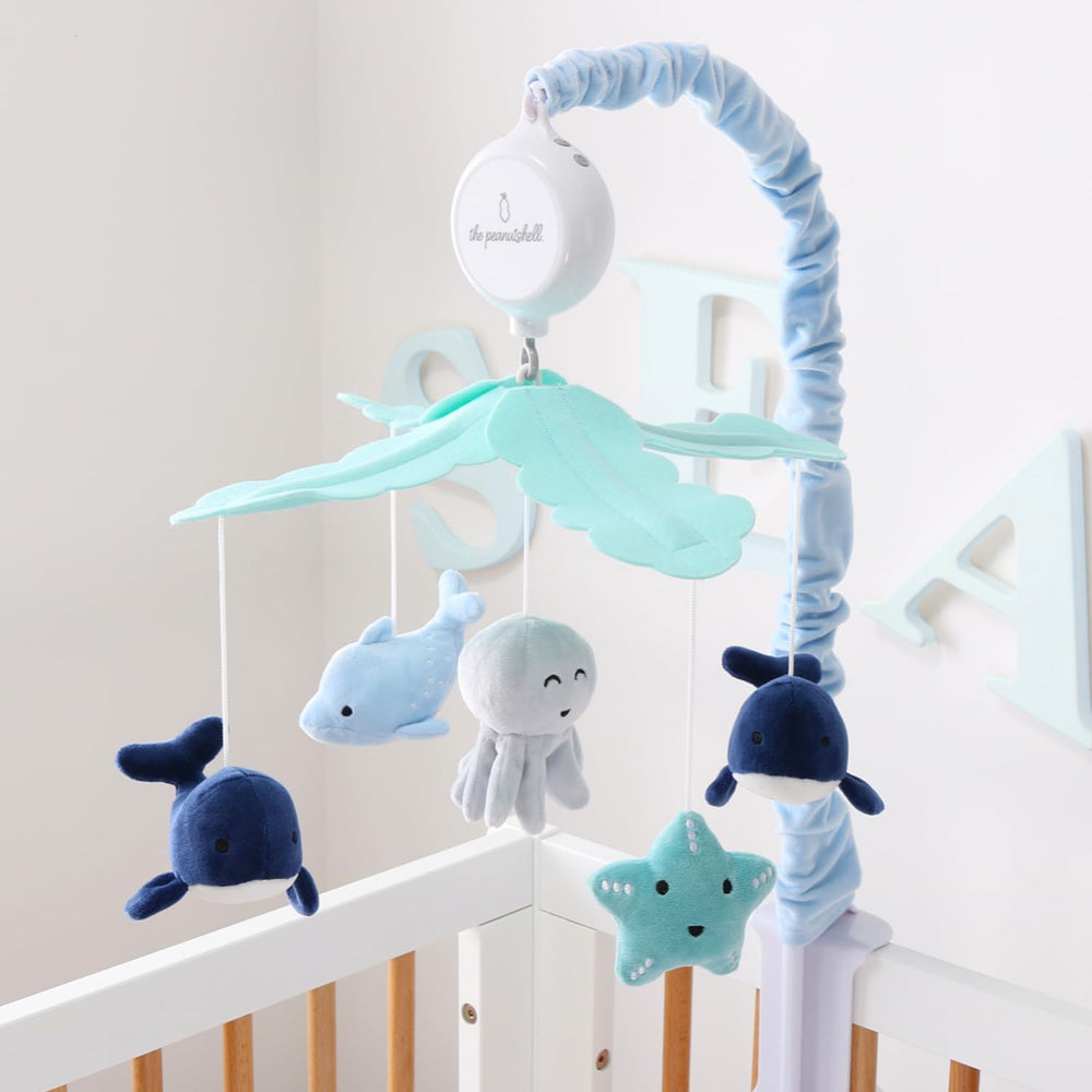 The Peanutshell crib mobile-starfish adds vibrant color to brighten nurseries and calm babies.