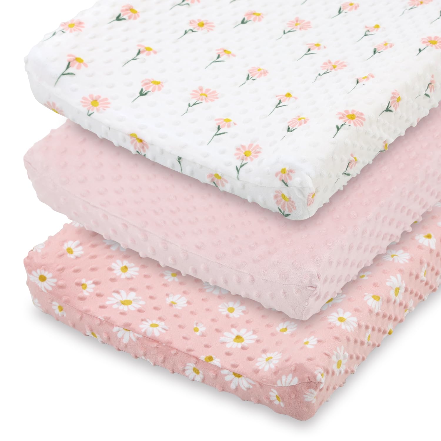 The Peanutshell daisy floral changing pad cover in pink keeps diaper changes cozy.