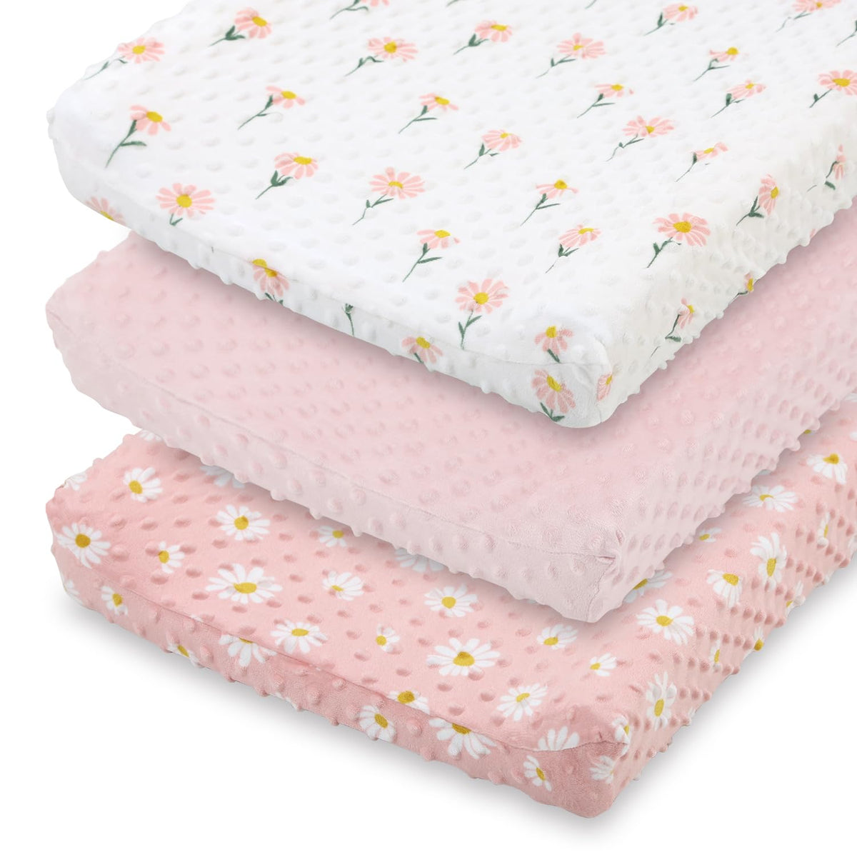 The Peanutshell daisy floral changing pad cover in pink keeps diaper changes cozy.