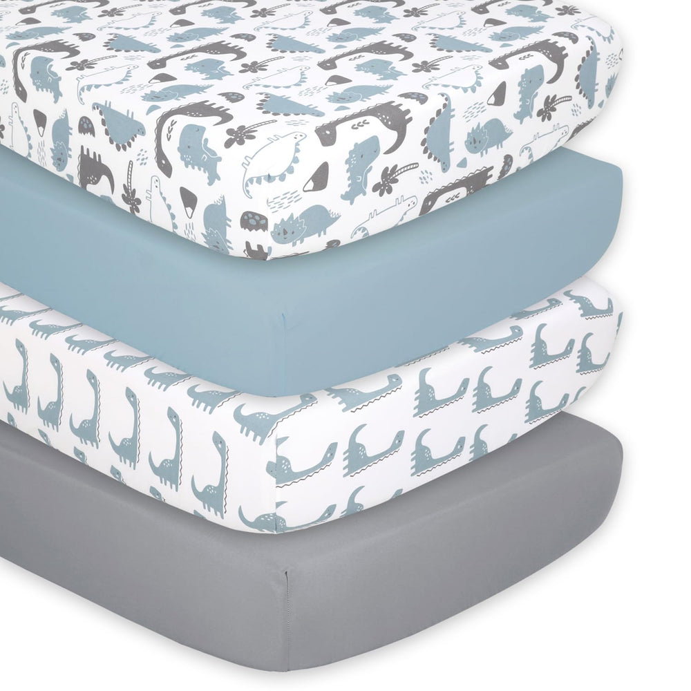 The Peanutshell dinosaur crib sheet closeup showing ultra-soft breathable fabric for comfy naps