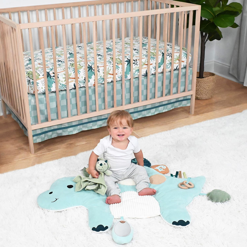 The Peanutshell dinosaur crib sheet closeup adds bright color for a joyful nursery.