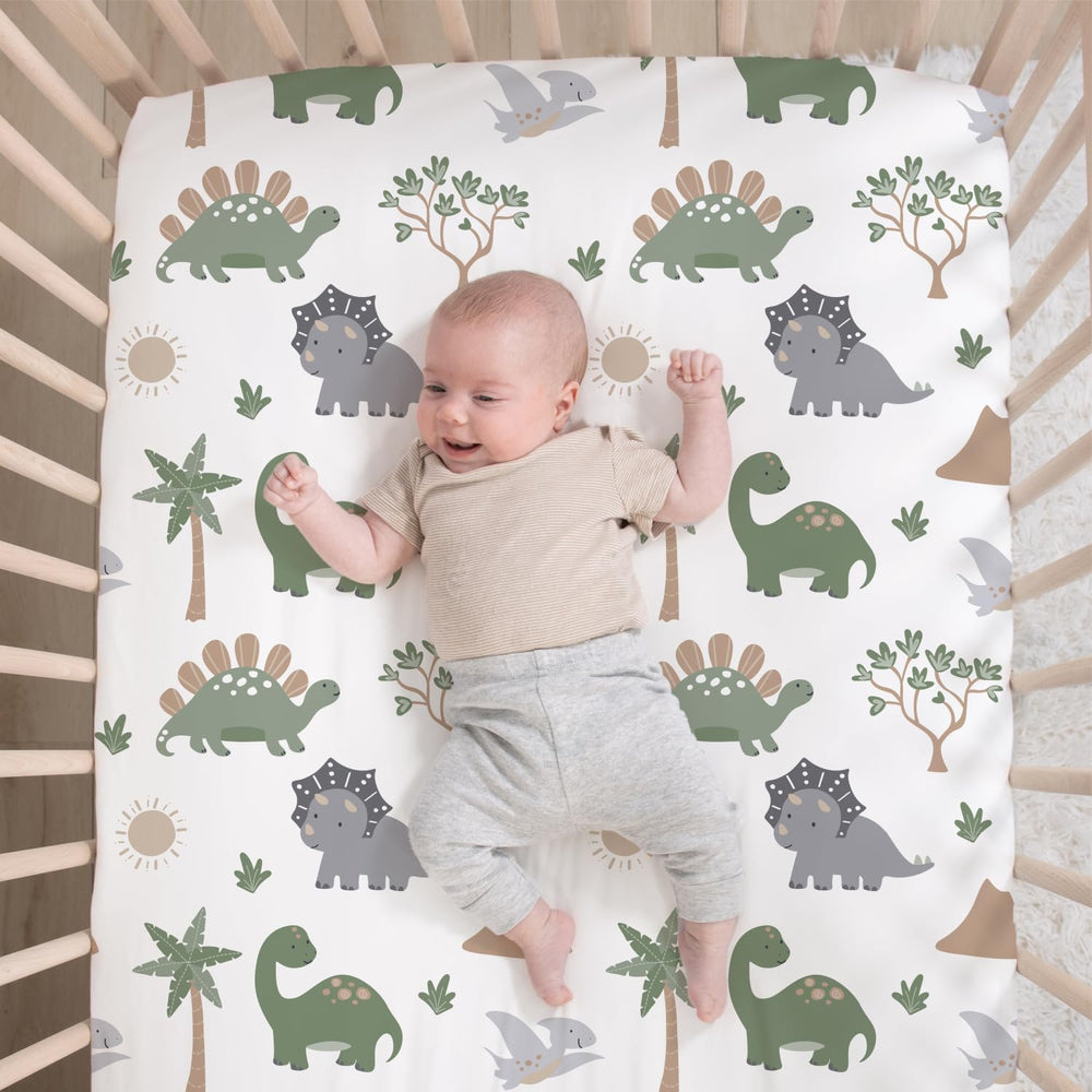 The Peanutshell Dinosaur Dreams bed skirt demonstrates complete nursery coordination and clean lines.