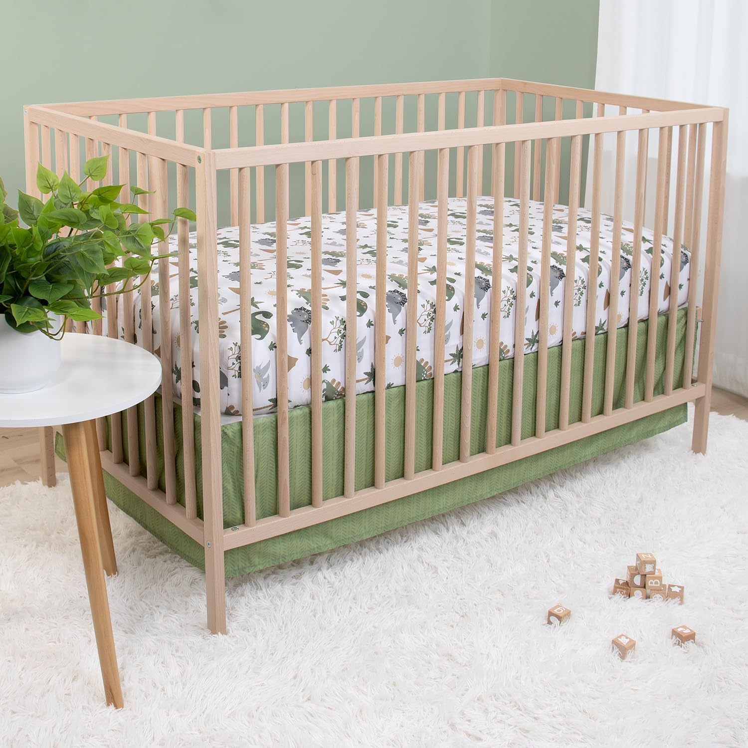 The Peanutshell Dinosaur Dreams fabric texture highlights soft microfiber that stays plush after washes.