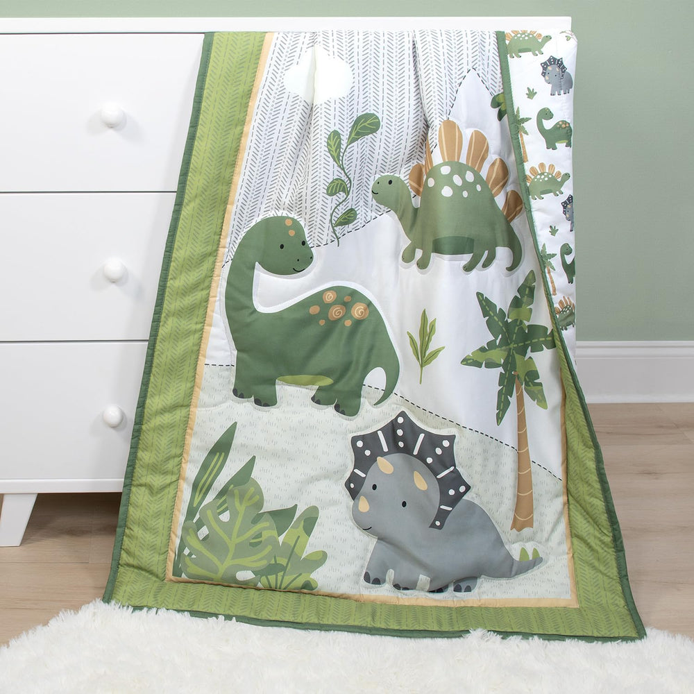 The Peanutshell Dinosaur Dreams quilt folded showcases color vibrancy and easy textile coordination.