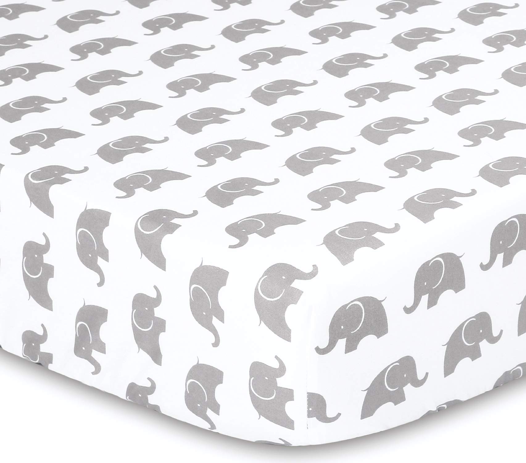 The Peanutshell Elephant Walk bed skirt completes a coordinated nursery setup.