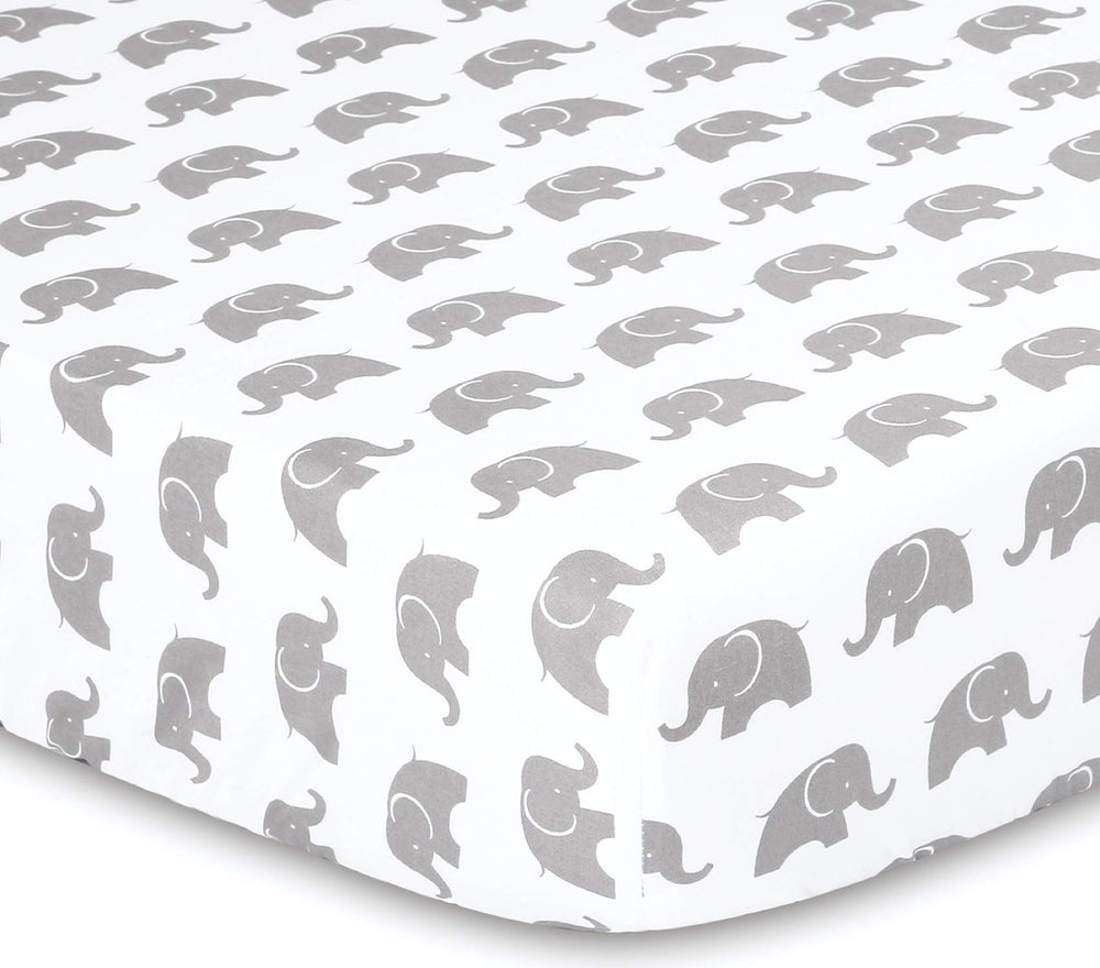 The Peanutshell Elephant Walk bed skirt completes a coordinated nursery setup.