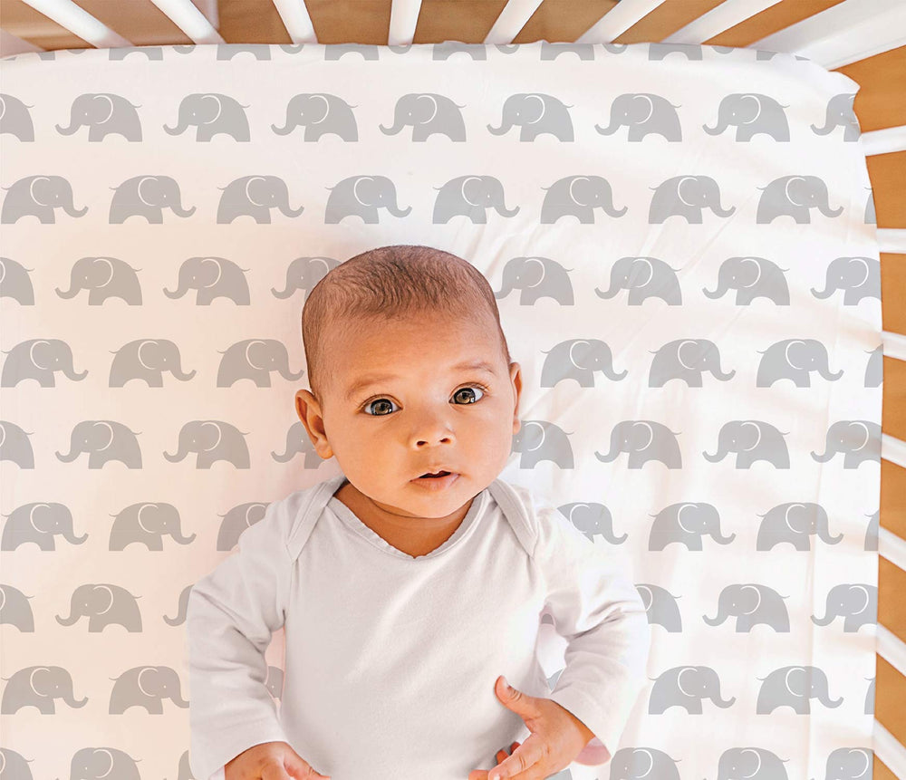 The Peanutshell Elephant Walk fitted sheet provides secure fit for standard crib mattresses.
