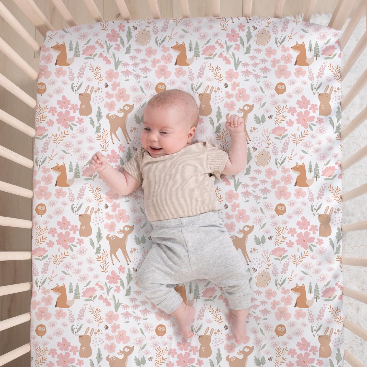The Peanutshell Fairytale Forest bed skirt adds a polished finish to the crib decor.