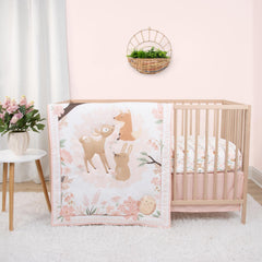 The Peanutshell Fairytale Forest crib quilt shown in soft woodland print for cozy naps.