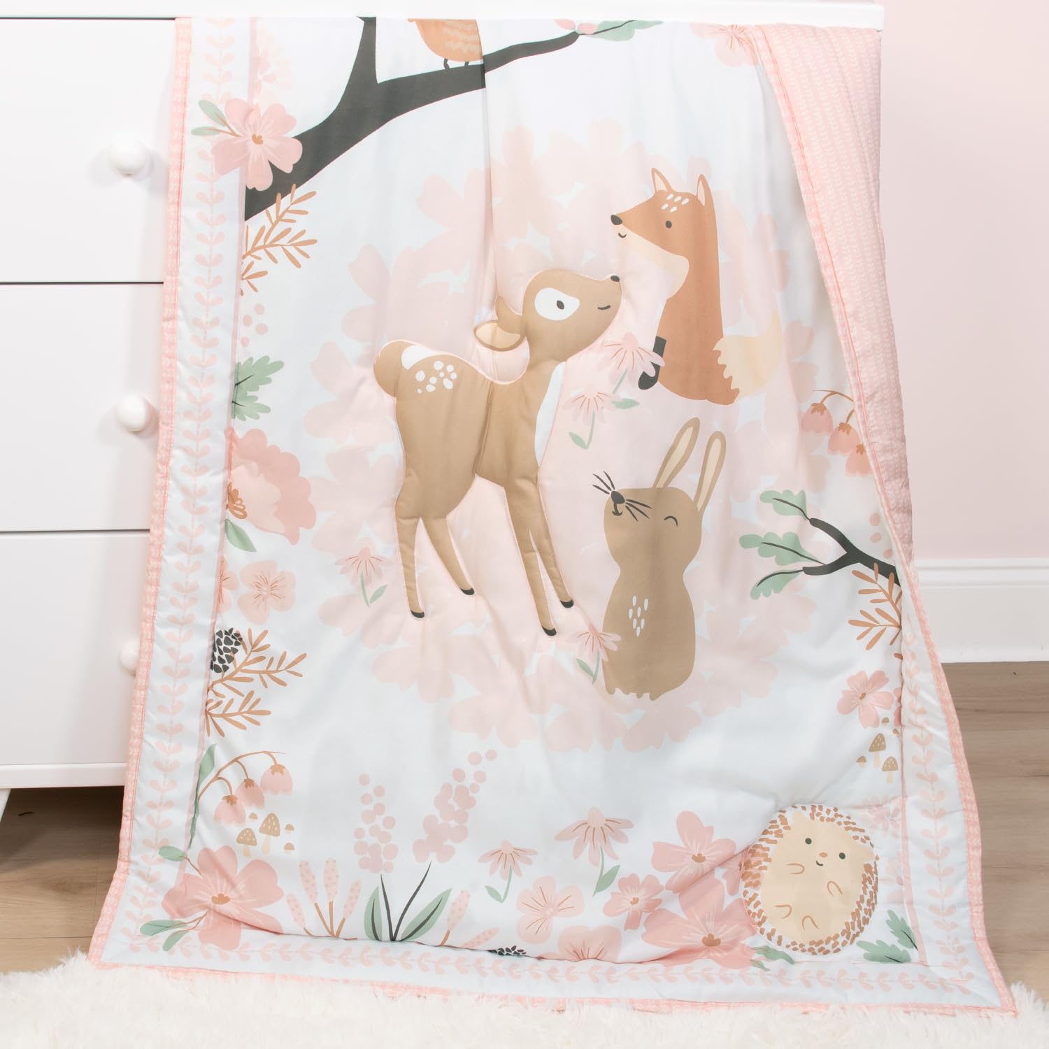 The Peanutshell Fairytale Forest pink-tones colorway emphasizes a gentle nursery palette.