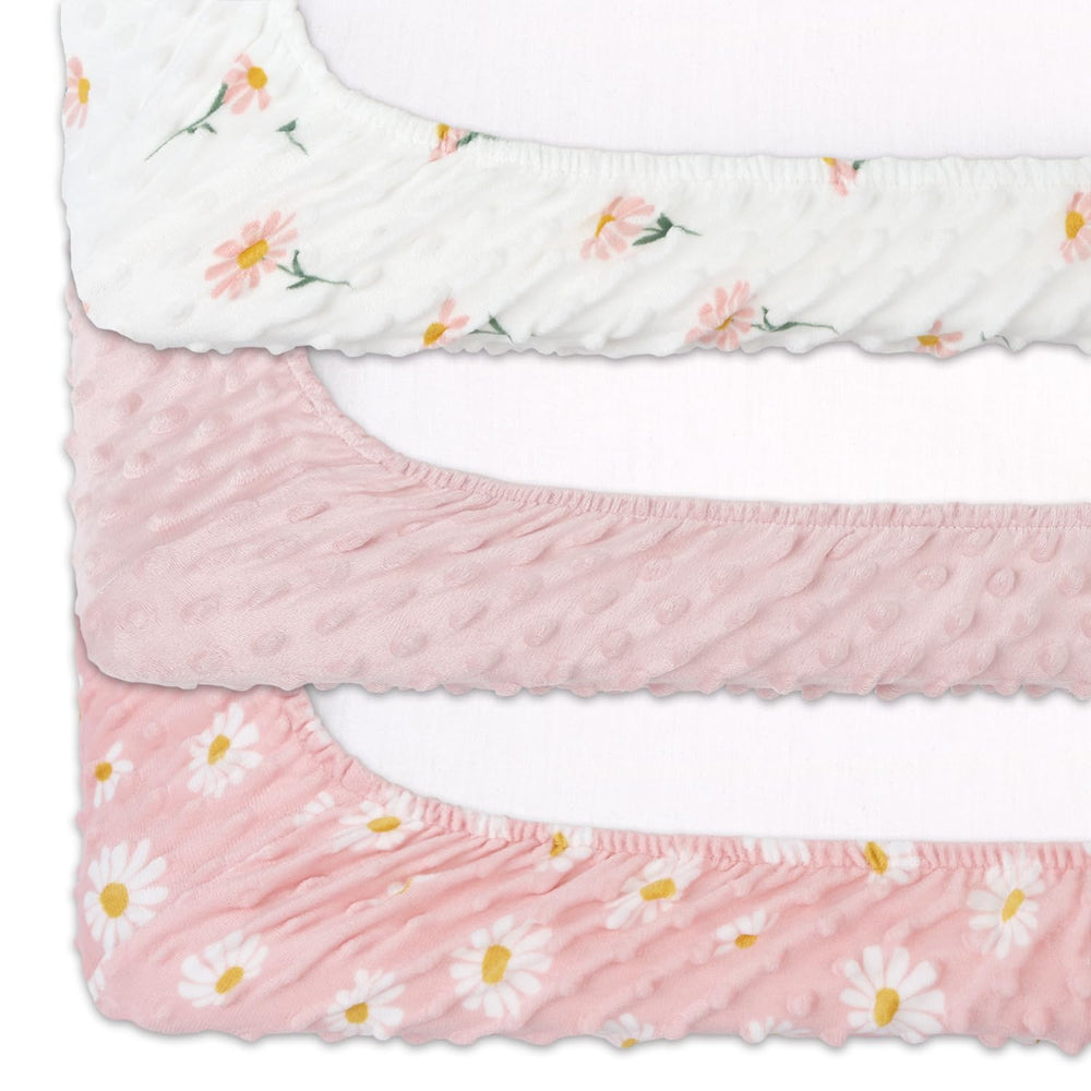 The Peanutshell floral crib bedding coordination helps create a cohesive nursery theme.