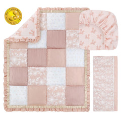 The Peanutshell Grace fitted sheet with pink bows offers breathable comfort for baby sleep.