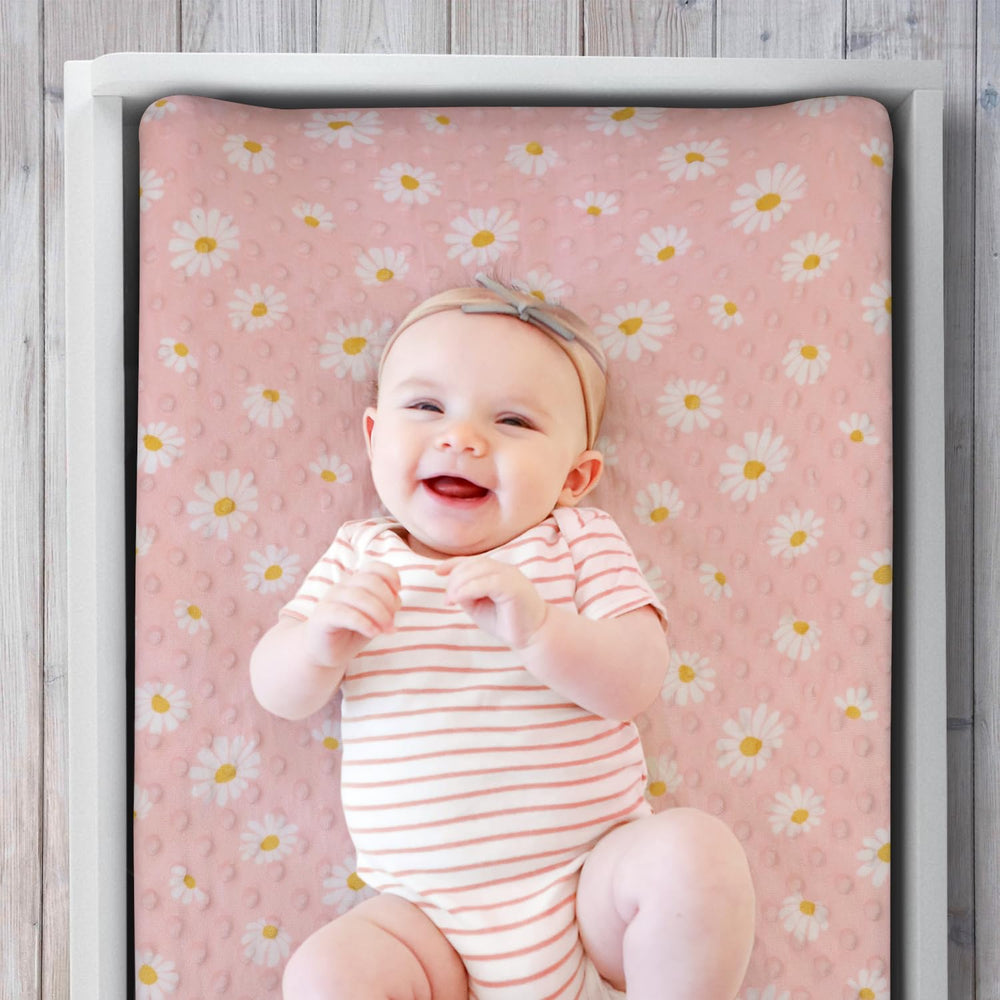 The Peanutshell minky dot velour changing pad cover adds ultra-soft comfort during diaper changes.