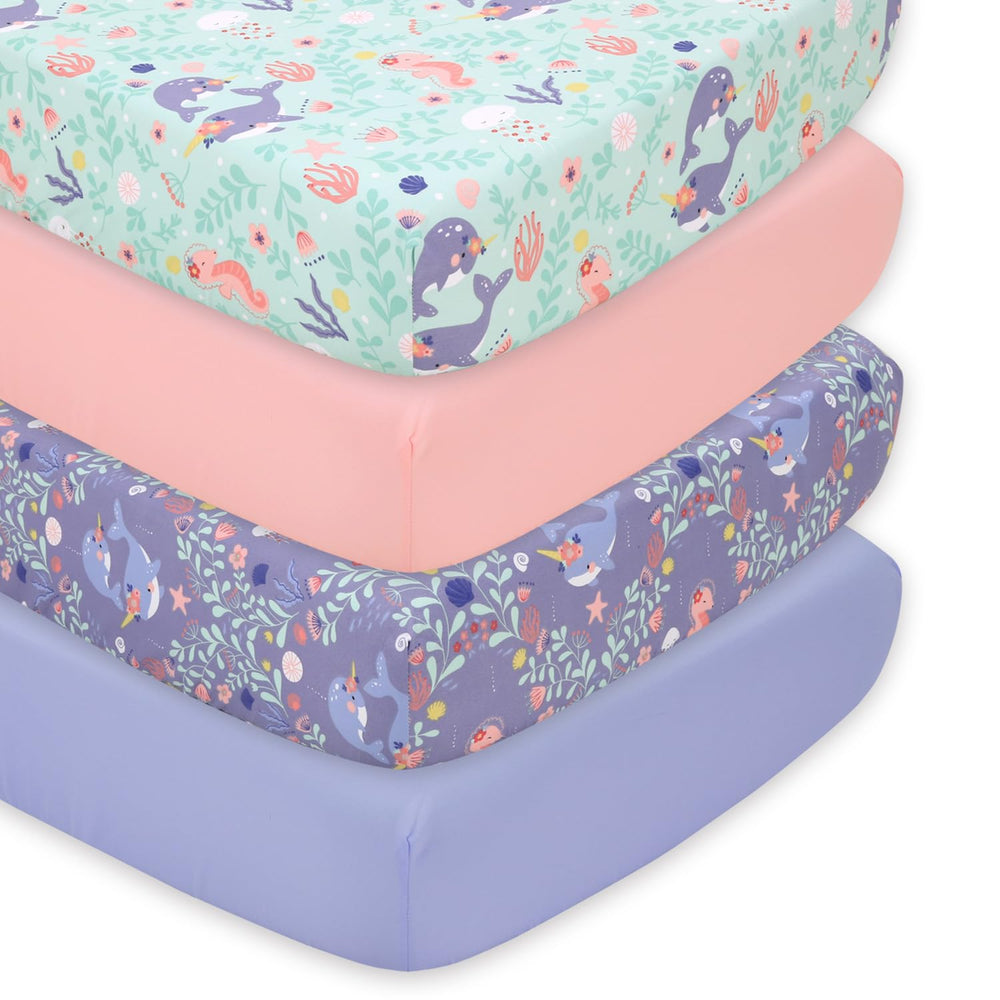 The Peanutshell Ocean Girl crib sheet packshot shows lavender, coral, pale aqua patterns for a serene nursery.