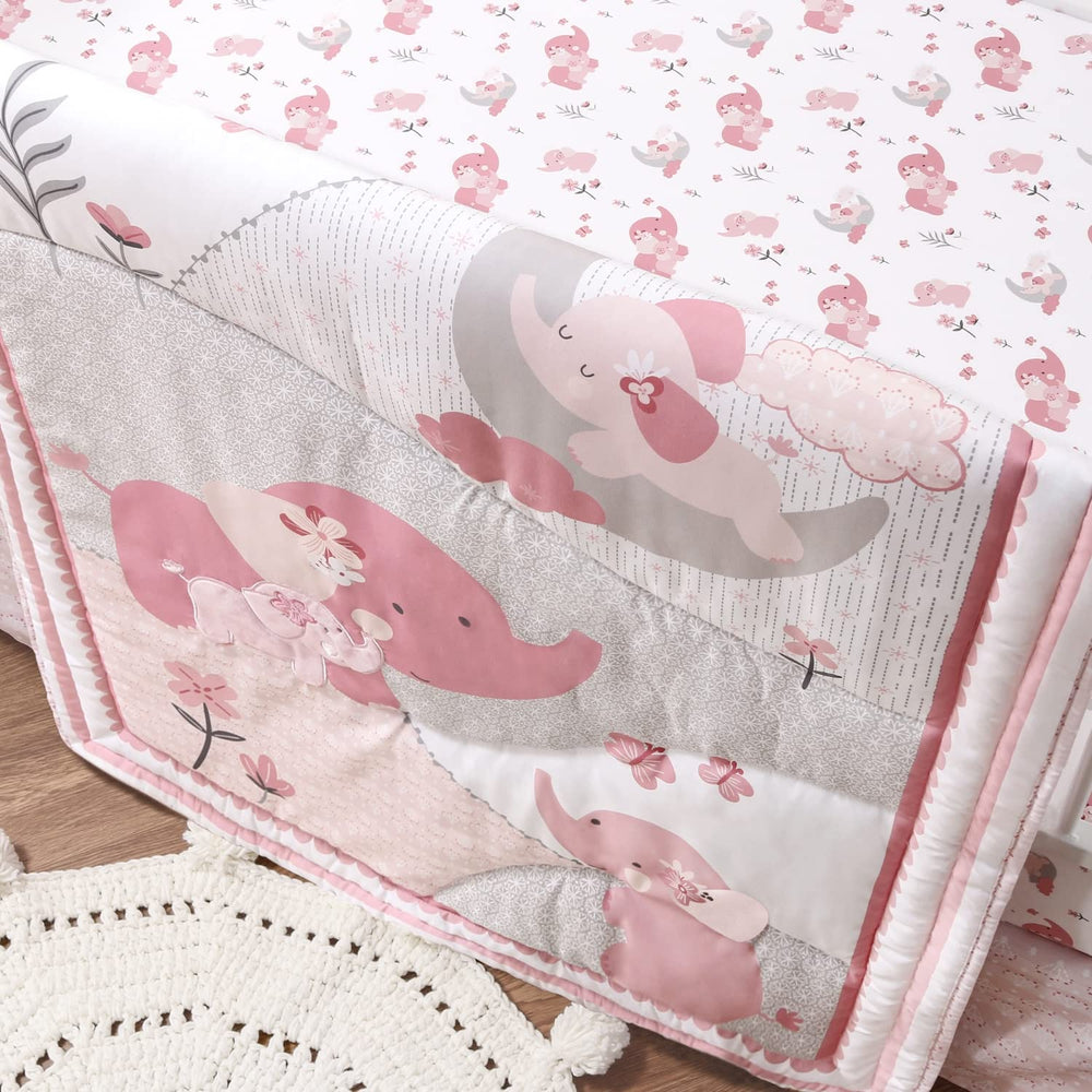The Peanutshell pink elephant fabric close-up emphasizes premium microfiber softness.