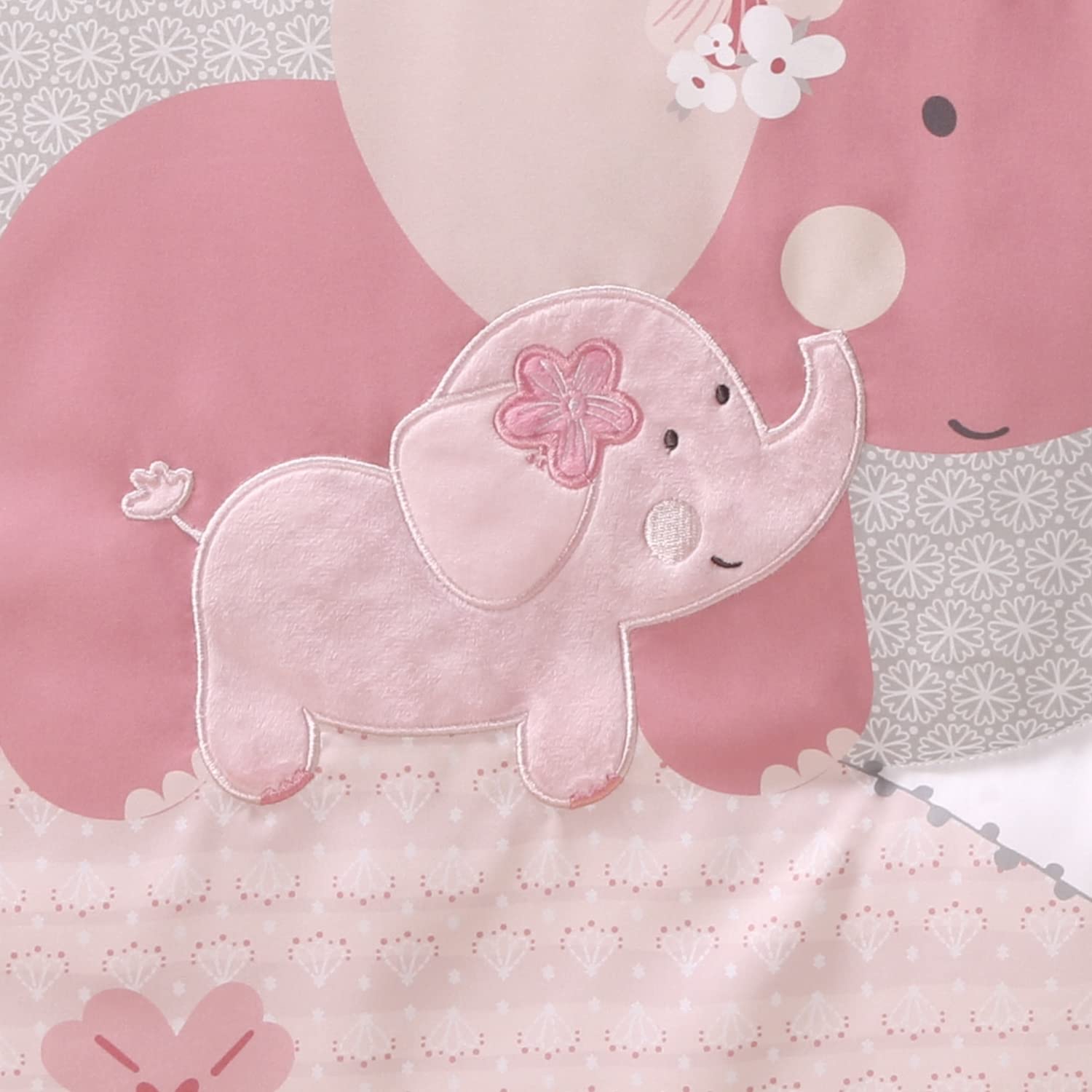 The Peanutshell pink elephant nursery display featuring a coordinated three-piece bedding set.