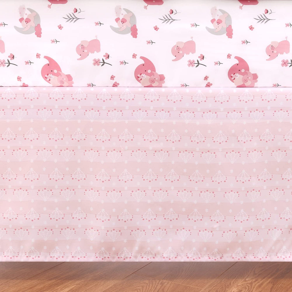 The Peanutshell pink elephant crib quilt detail highlighting print and cozy texture.