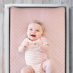 The Peanutshell pink floral nursery decor complements baby girl rooms for a cohesive look.