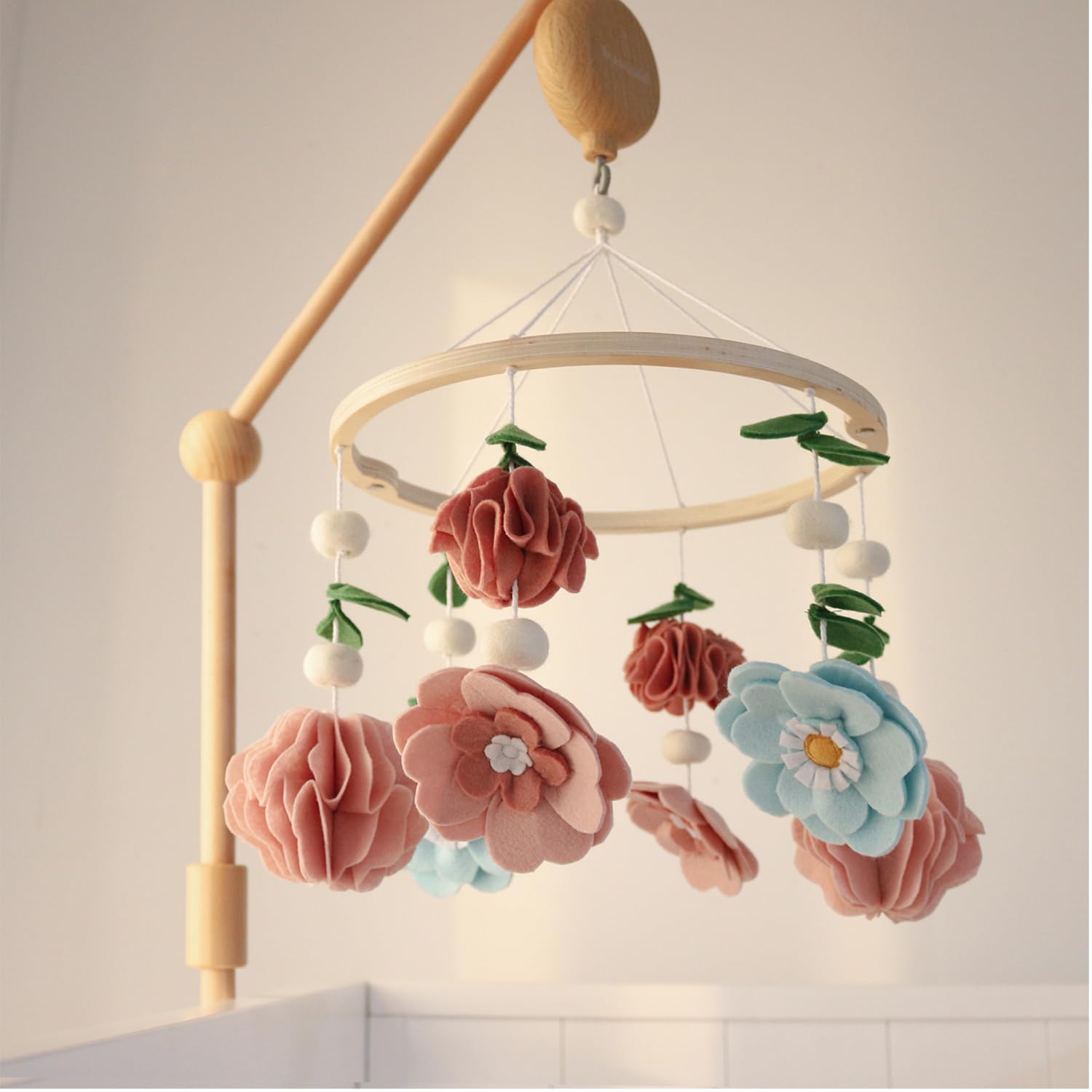 The Peanutshell quick-set-up crib mobile is easy to move and store between rooms.