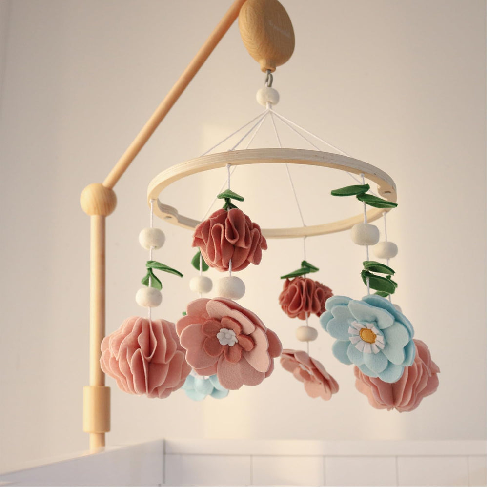 The Peanutshell quick-set-up crib mobile is easy to move and store between rooms.