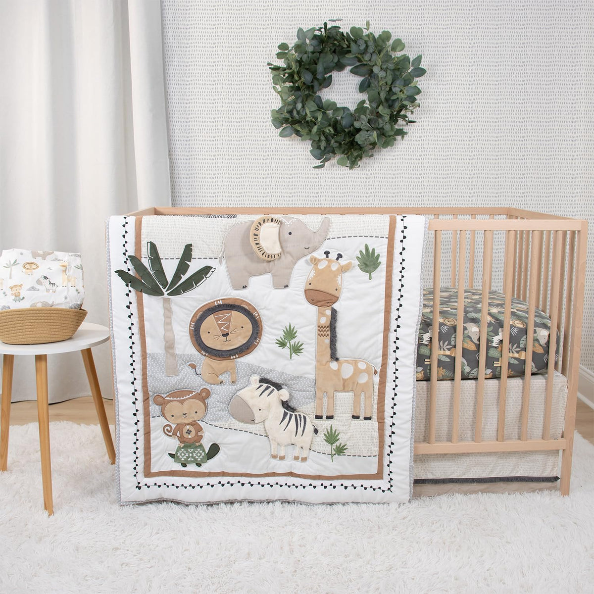 The Peanutshell safari-theme crib bedding adds playful, cozy charm to the nursery.