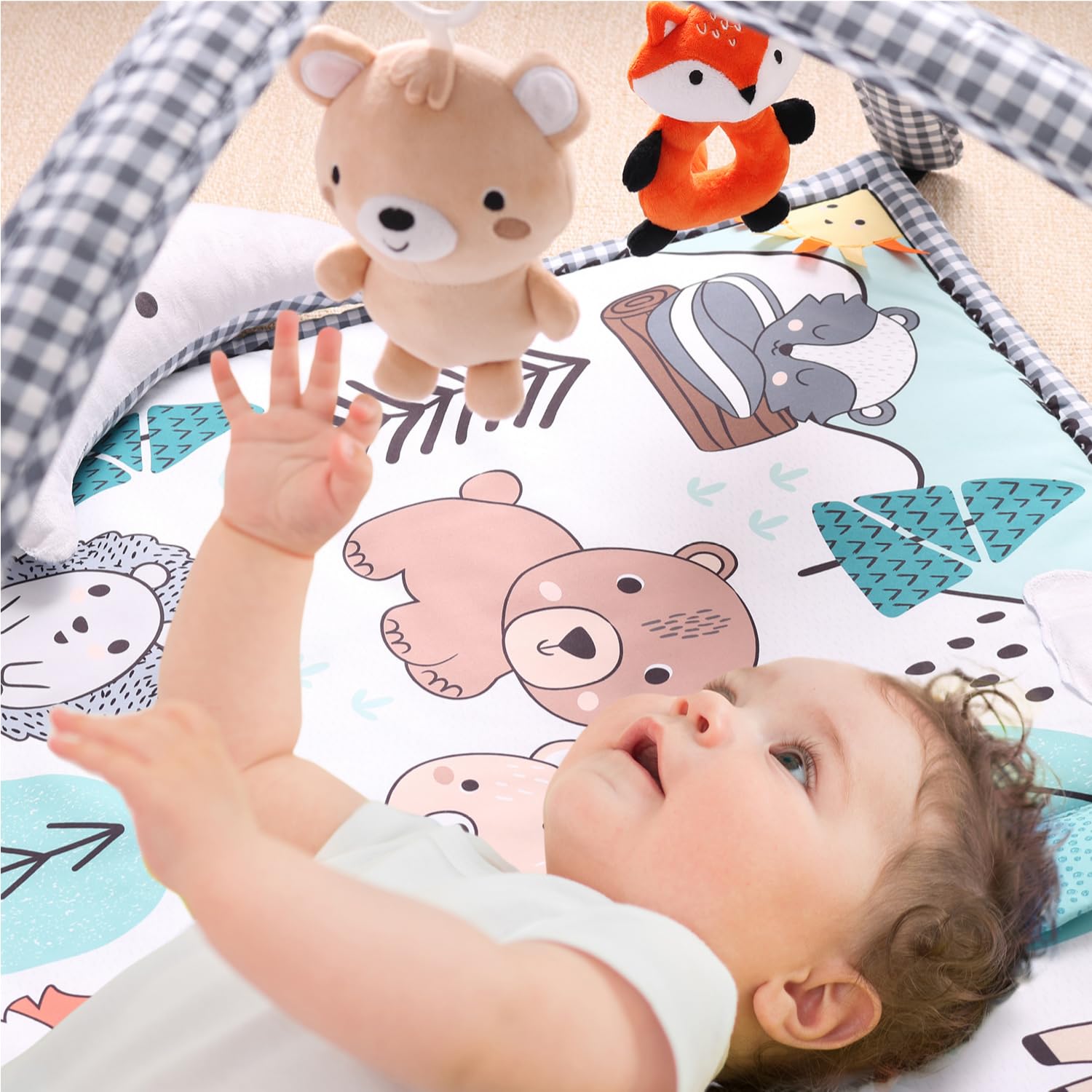 The Peanutshell soft padded woodland play mat provides cozy tummy time and floor play.