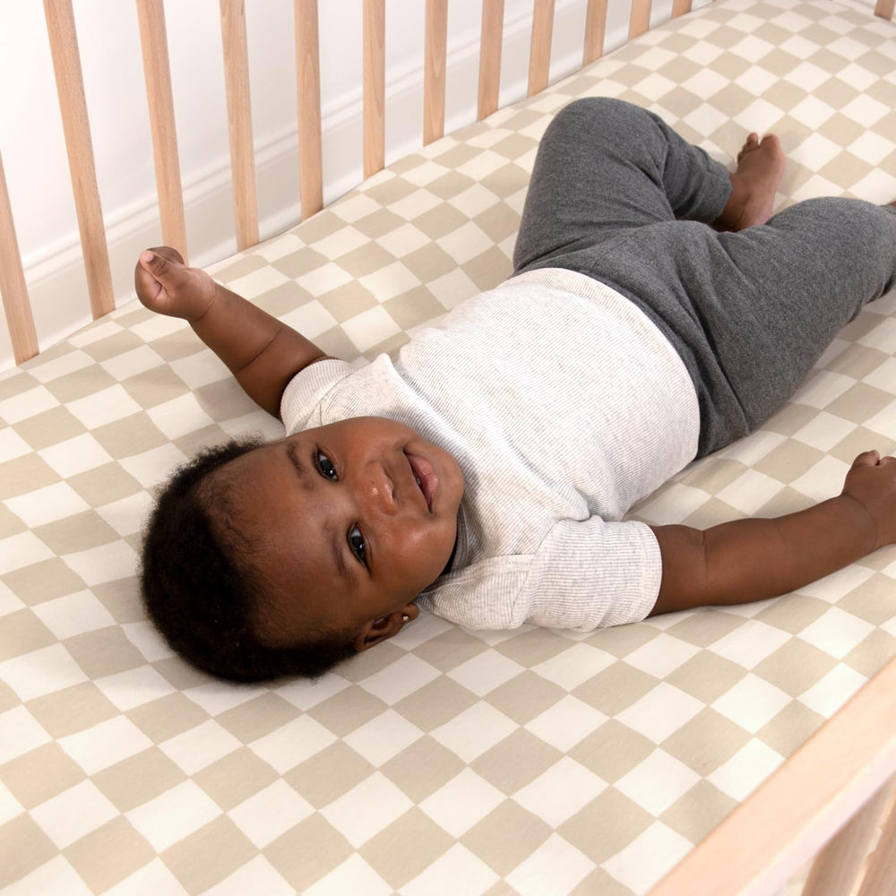 The Peanutshell standard-fit crib sheets for 52x28 mattresses offer secure, smooth sleeping surfaces