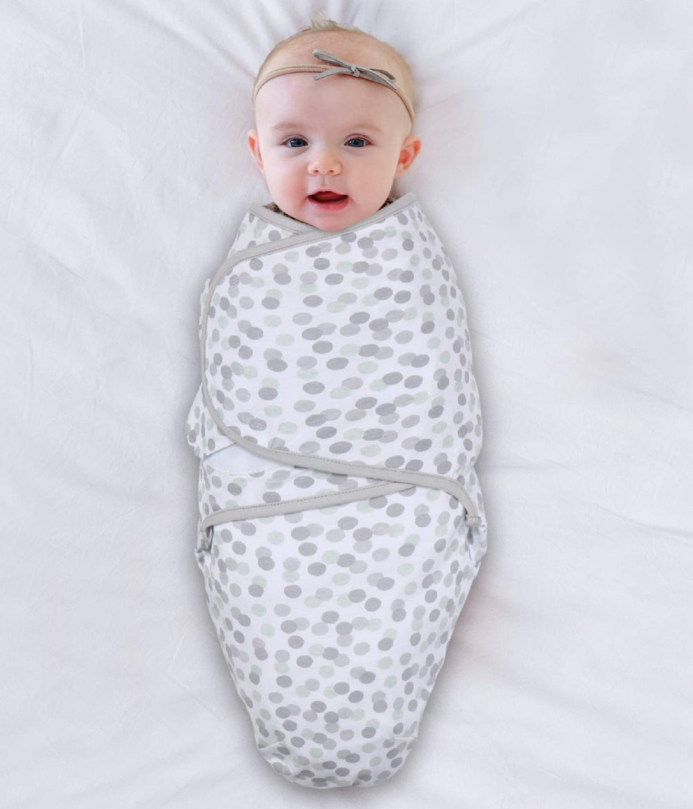 The Peanutshell swaddle blanket wings-closure close-up demonstrates adjustable snug fit