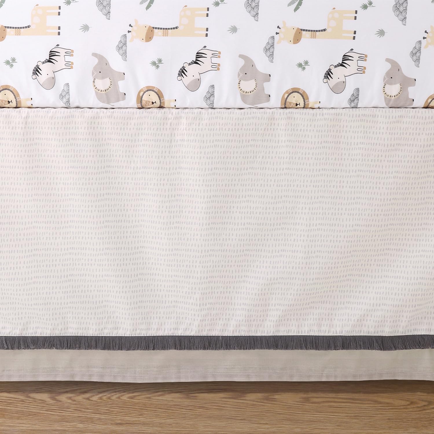 The Peanutshell tailored bed skirt adds polished nursery style and hidden storage.