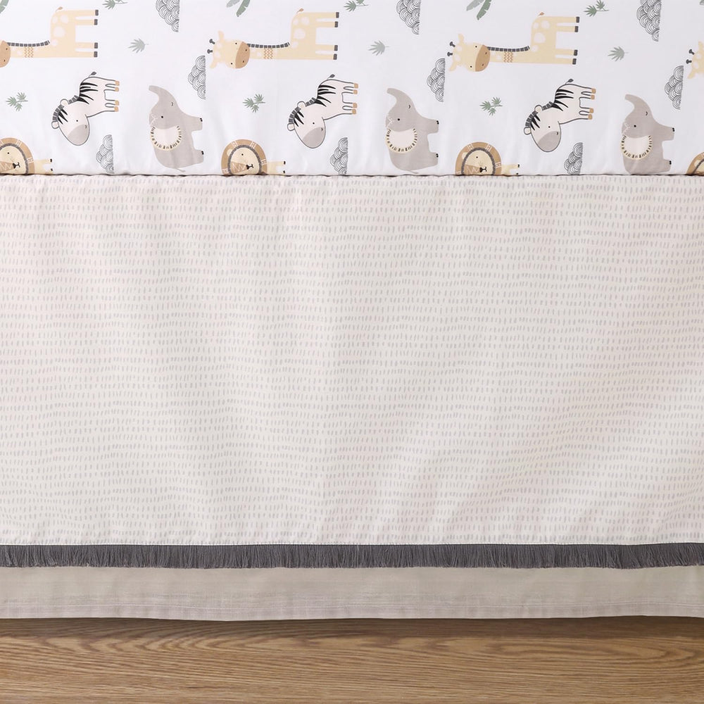 The Peanutshell tailored bed skirt adds polished nursery style and hidden storage.