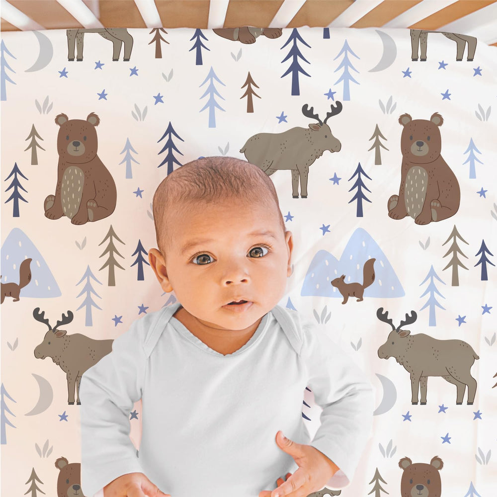 The Peanutshell Under The Stars bed skirt detail highlights coordinated nursery decor