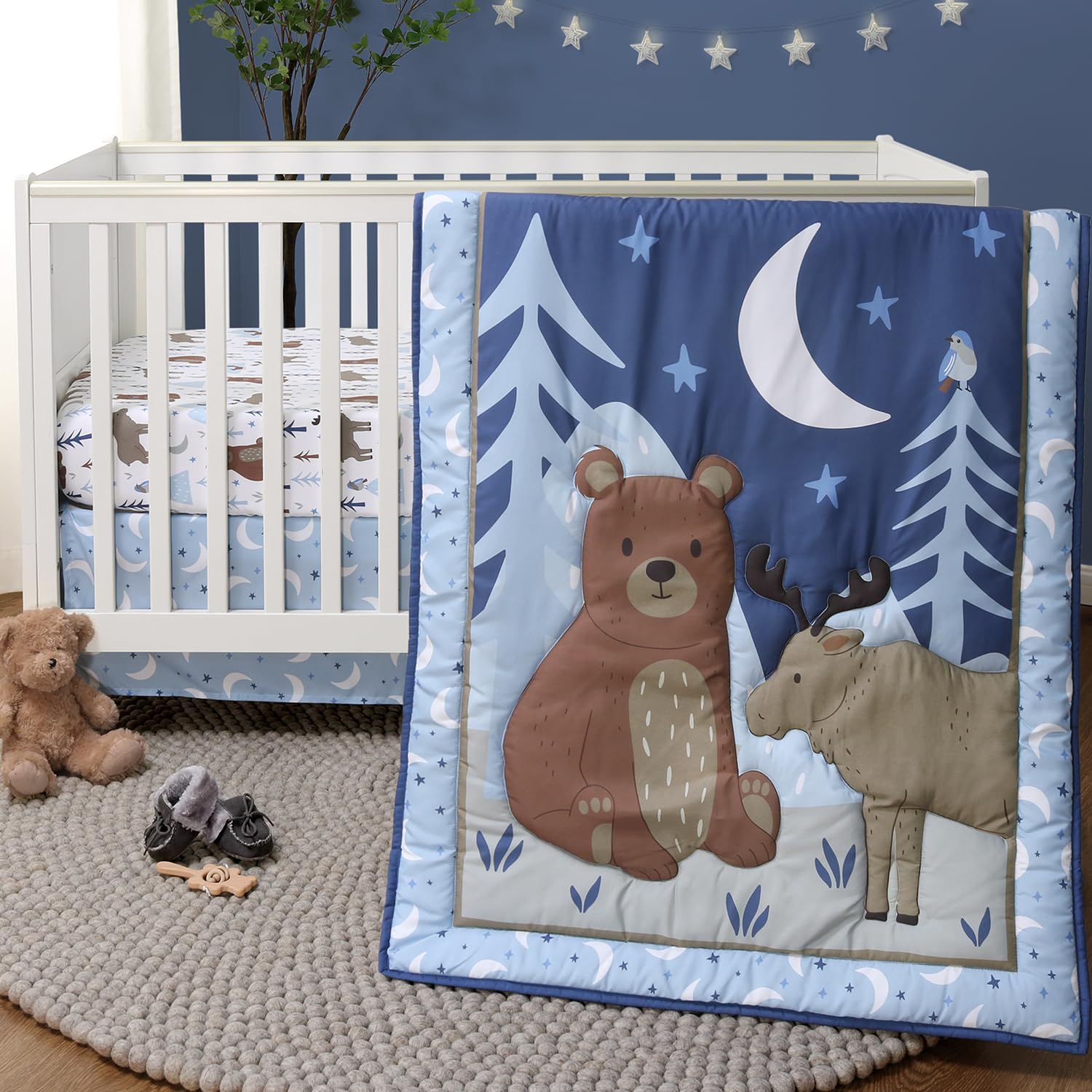 The Peanutshell Under The Stars quilt close-up shows cozy woodland print