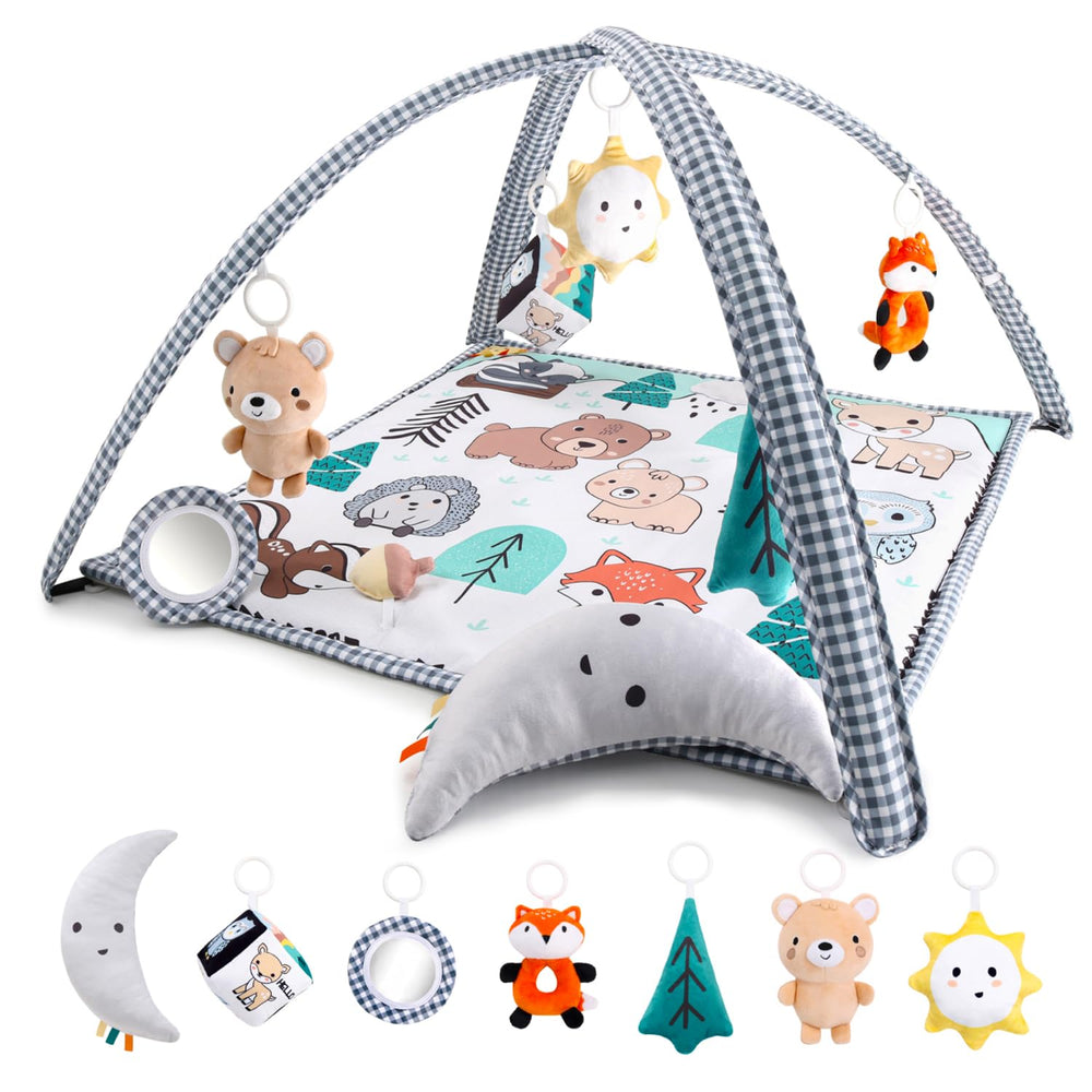 The Peanutshell Woodland fox toy on the play gym promoting reaching and sensory play.