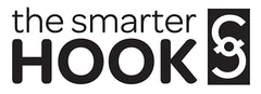 The Smarter Hook Tsh White mounted on a cart handle for hands-free organization.
