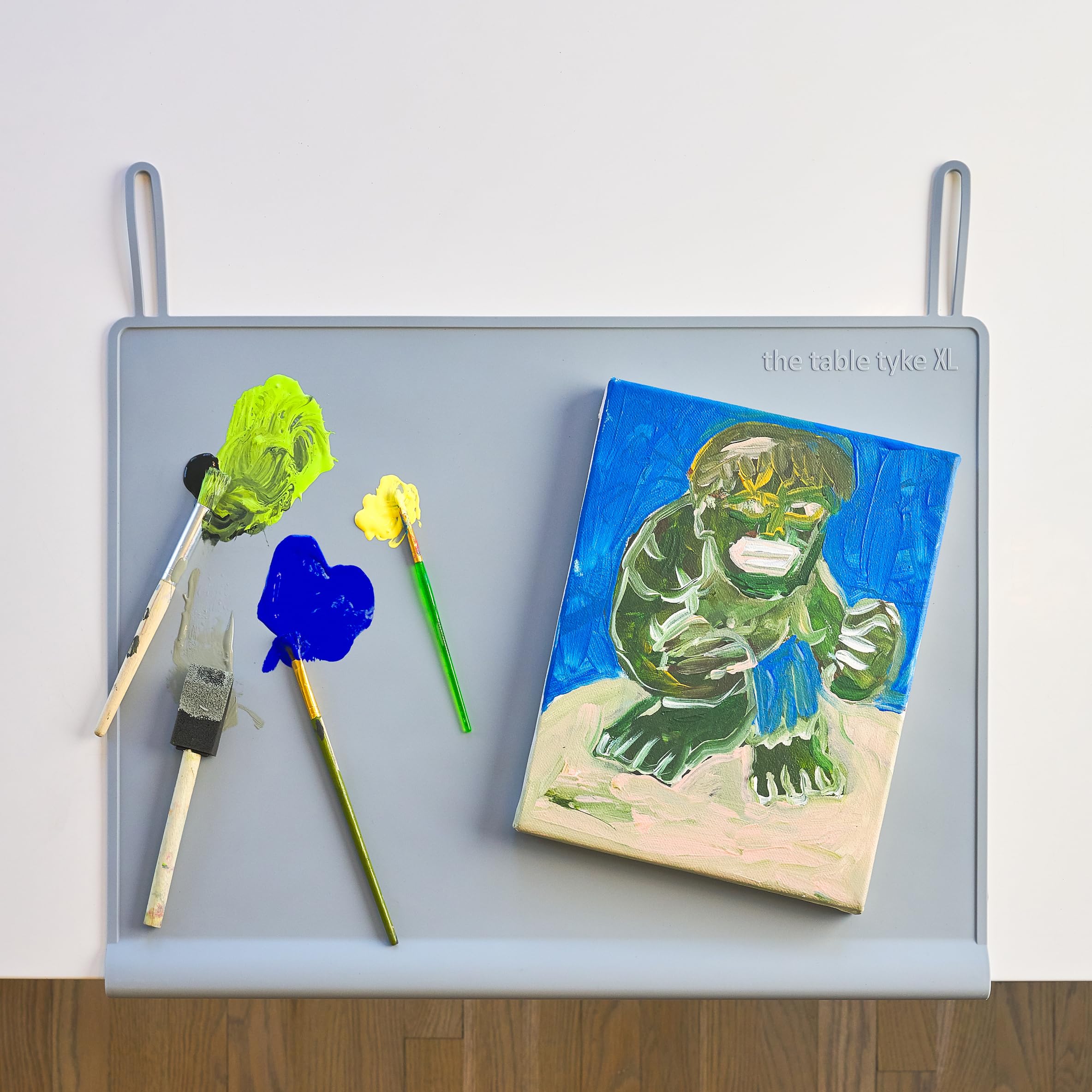 The Table Tyke roll-up-loops shot highlights easy, compact packing for on-the-go meals.