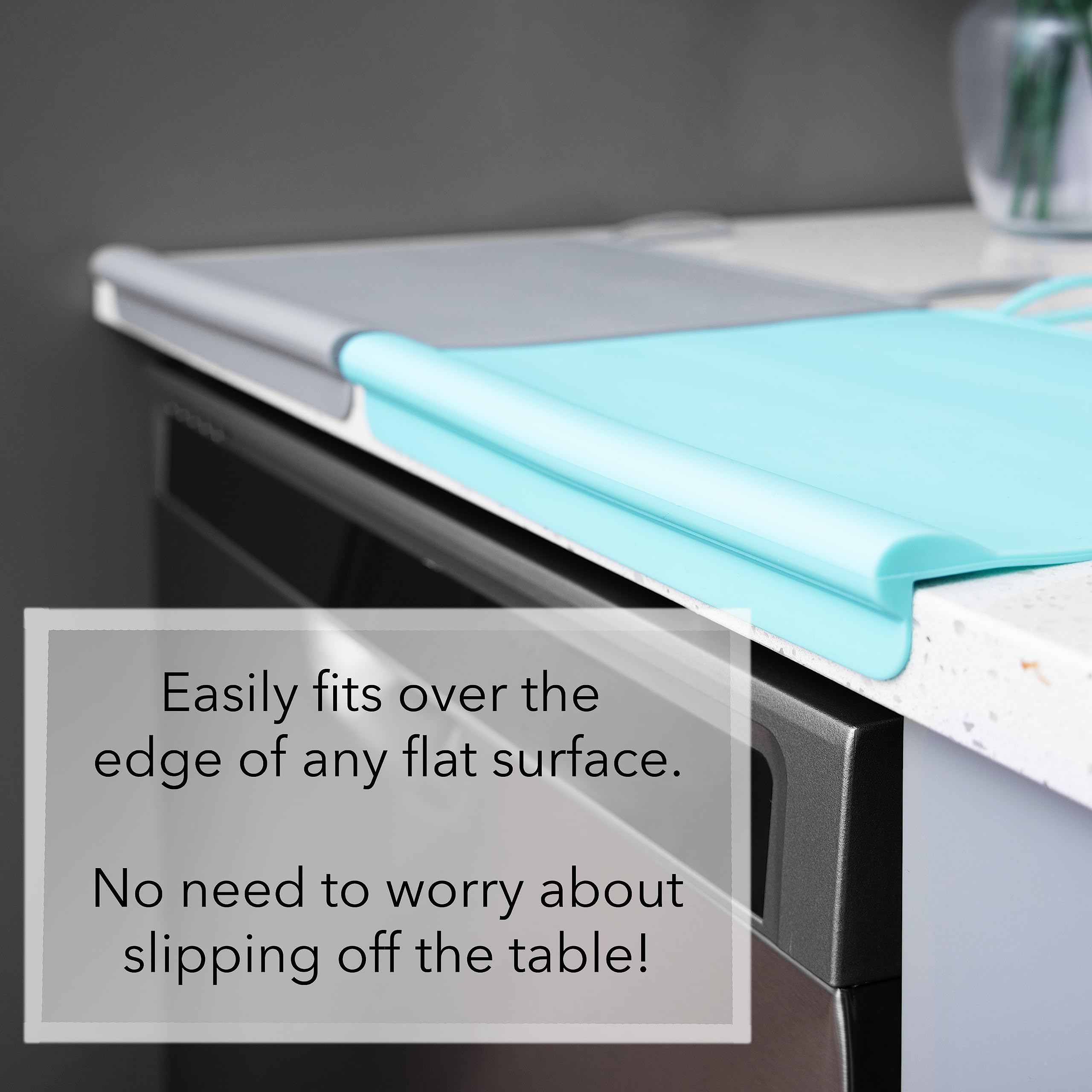 The Table Tyke Placemat XL shown on a highchair with strong suction cups