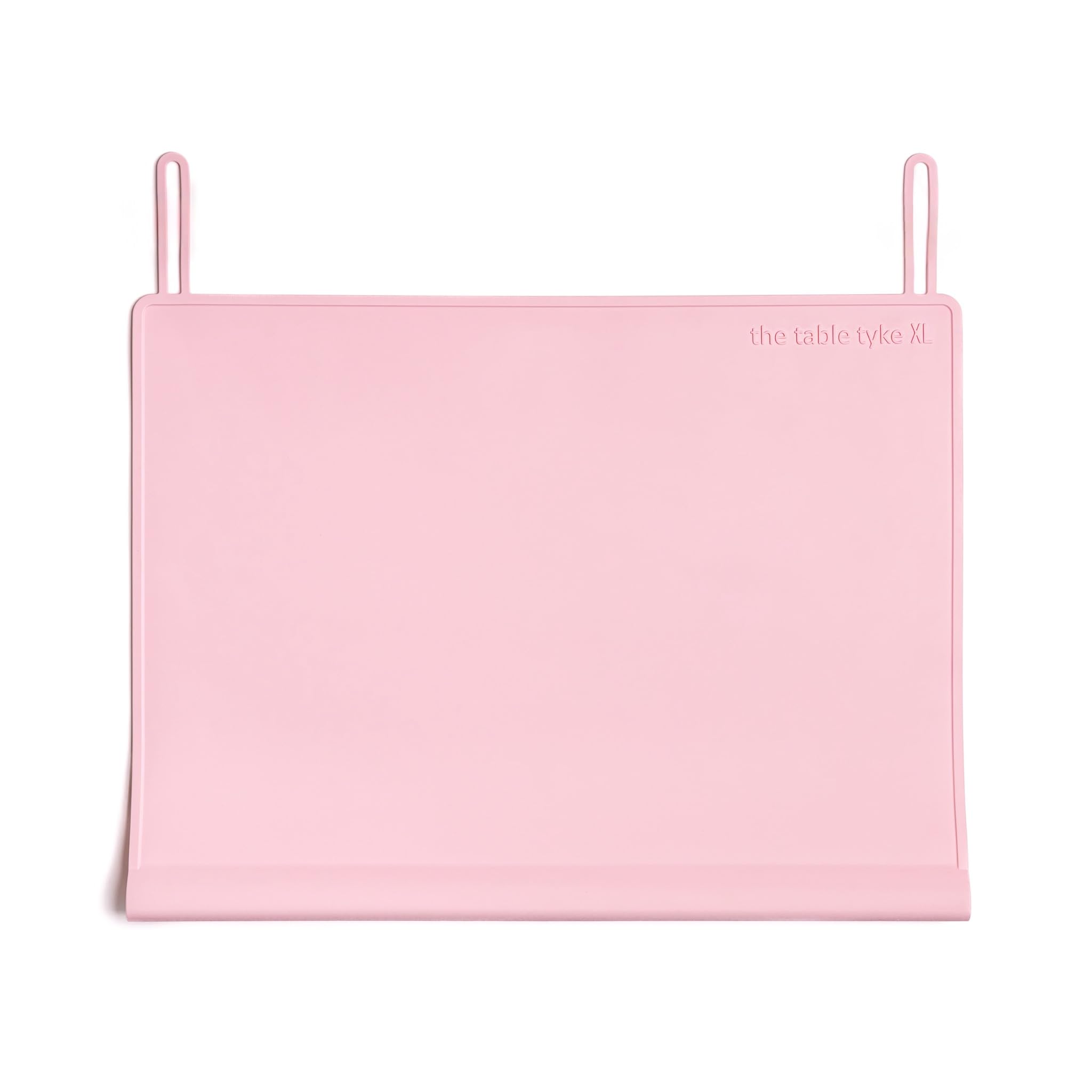 The Table Tyke Placemat XL teething-edge bumper cushions little mouths at mealtime.