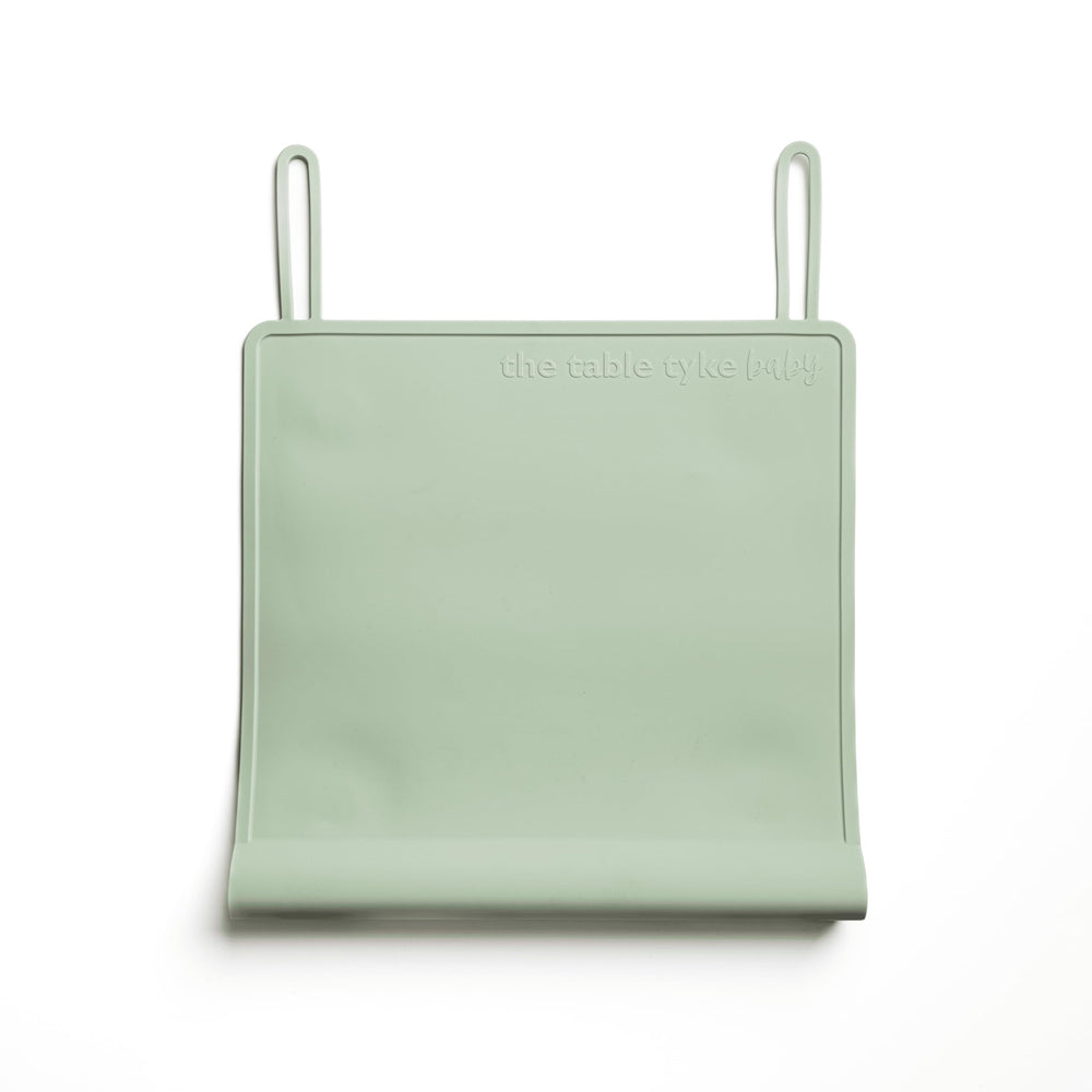 The Table Tyke silicone placemat edge-bumper sage-green protects little mouths from sharp table edges